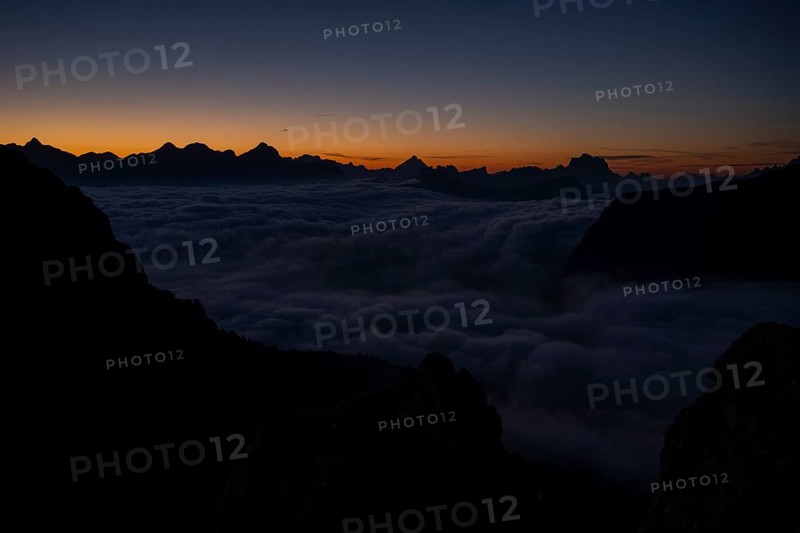 Sunrise over a sea of fog and Dolomite peaks in the background, Corvara, Dolomites, Italy, Europe