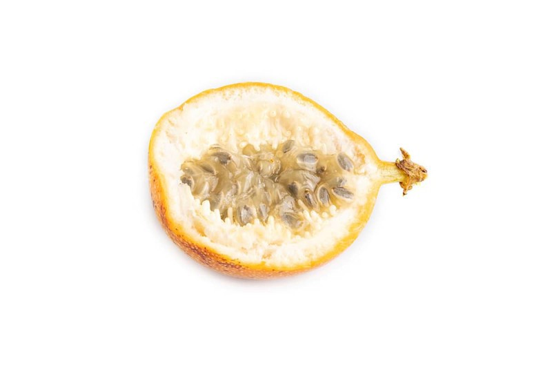 Granadilla isolated on white background. Side view. Tropical, healthy food, summer, exotic, minimalism