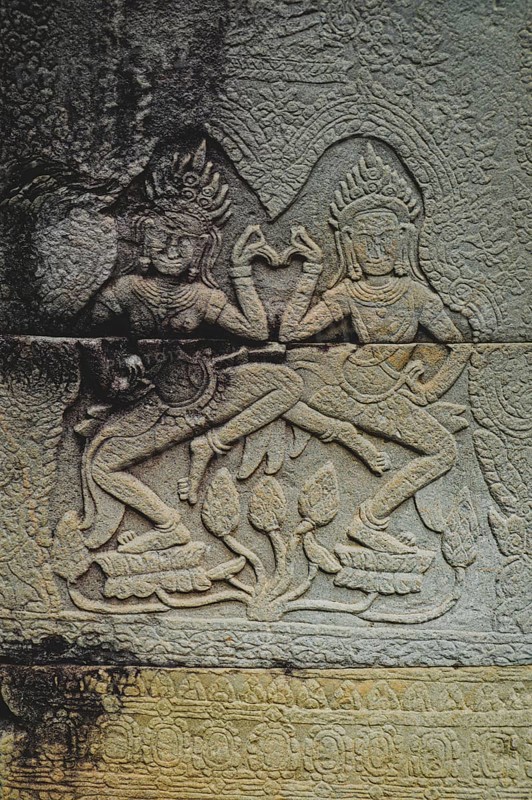Bas-relief of Apsaras, celestial dancers from Hindu mythology, carved in stone in Khmer style. Angkor Wat. Siem reap, Cambodia, Asia