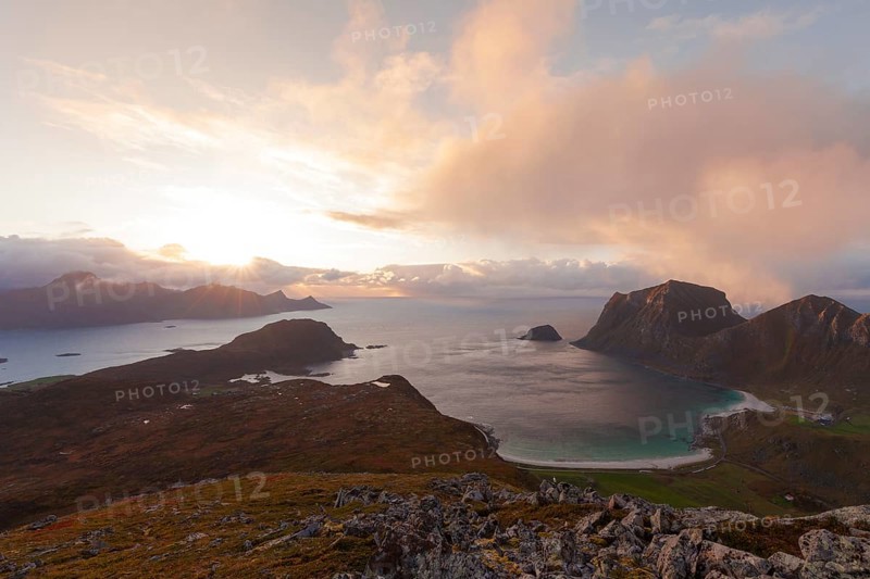 View of Haukland Beach from the summit of Holandsmelen, Lofoten. Dramatic sunset in autumn