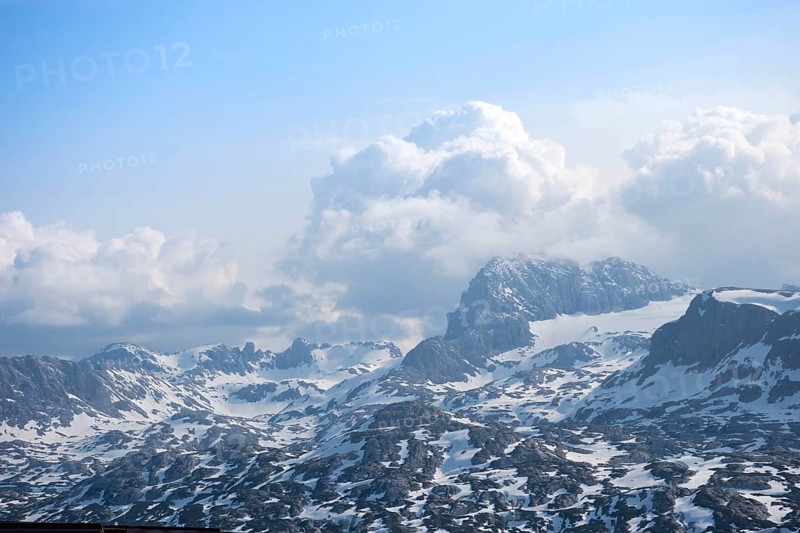Amazing mountains panorama from 5 Fingers viewing platform in the shape of a hand with five fingers on Mount Krippenstein in the Dachstein Mountains of Upper Austria, Salzkammergut region, Austria, Europe