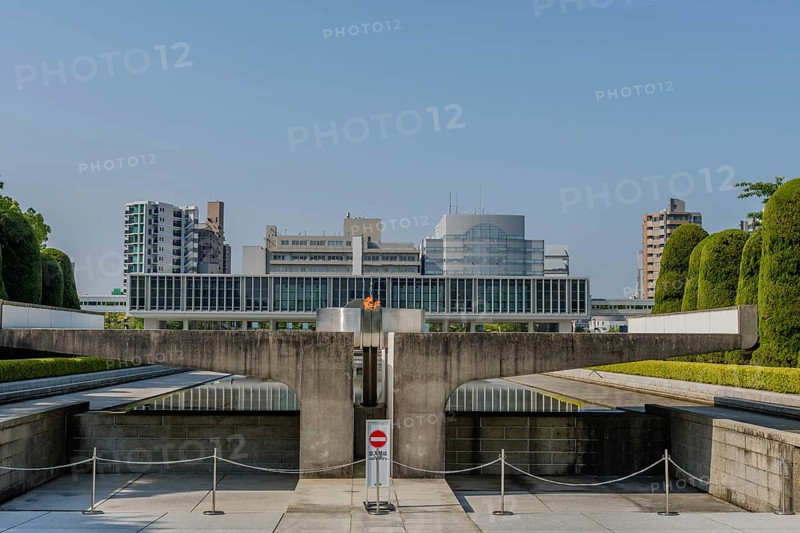 Peace Fire at Memorial Park with city buildings in background in Hiroshima, Japan, Asia