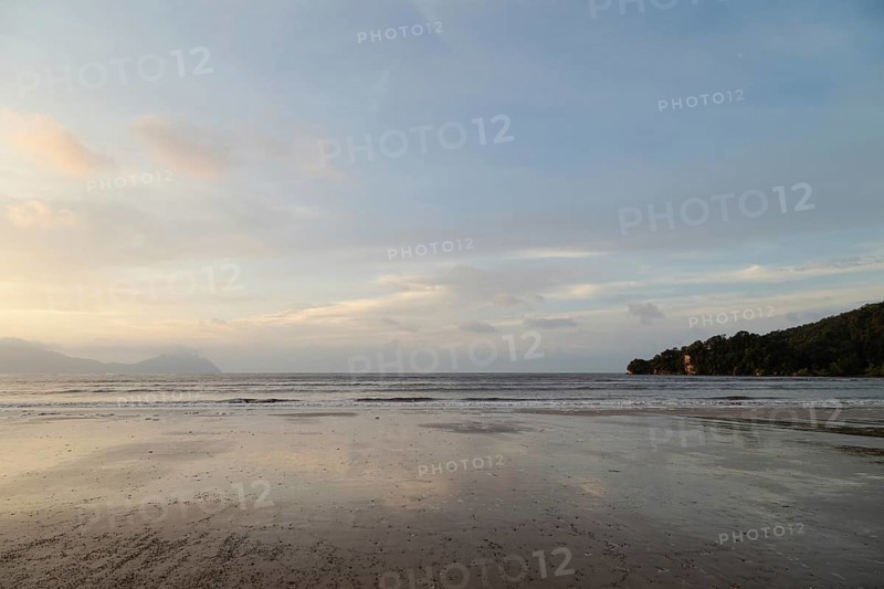 Bako national park, sea sandy beach, overcast, cloudy sunset, sky and sea, low tide. Vacation, travel, tropics concept, no people, Malaysia, Kuching, Asia