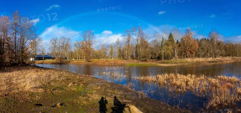 Rainbow over the source of the Danube, the confluence of the Breg and Brigach rivers to form the Danube, Donaueschingen, Baden-Wuerttemberg, Germany, Europe