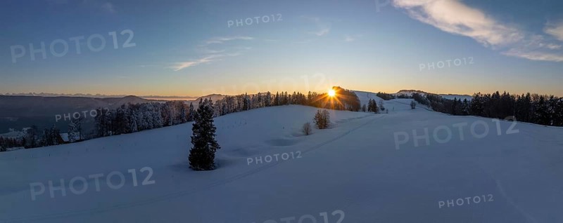 Sunset over the second Jura chain in winter, foreground contours of sinkholes, view towards the first Jura chain with Weissenstein, drone image, Brunnersberg, Solothurn, Switzerland, Europe