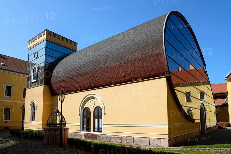 An unusual combination of modern glass architecture and traditional building elements under a clear blue sky, officers' palace, church, Komarno, Komarom, Komorn, Nitriansky kraj, Slovakia, Europe