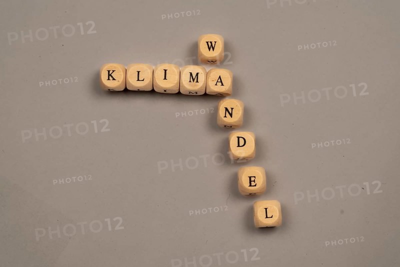 Cubes with letters form the word climate change, light background, top view, studio shot, Germany, Europe