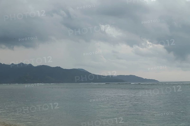 Lombok and Gili Air islands, overcast, cloudy day, sky and sea. Vacation, travel, tropics concept, no people. Sunset, sand beach