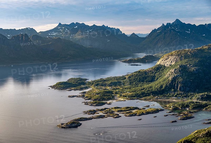Fjord Raftsund and mountains in atmospheric evening light, view from the summit of Dronningsvarden or Stortinden, Vesteralen, Norway, Europe