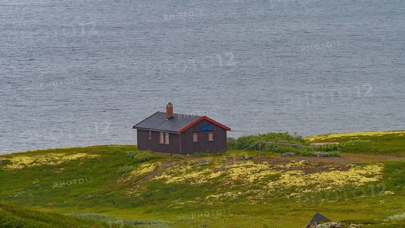 Shot of a hut at Soenstevatn in the rain, landscape format, inland waters, log cabin, holiday home, Fjell, Fjellhuette, plateau, wooden house, landscape, landscape photo, panoramic shot, summer, shore, clouds, secluded, remote, lonely, Uvdal, Viken, Norway, Europe