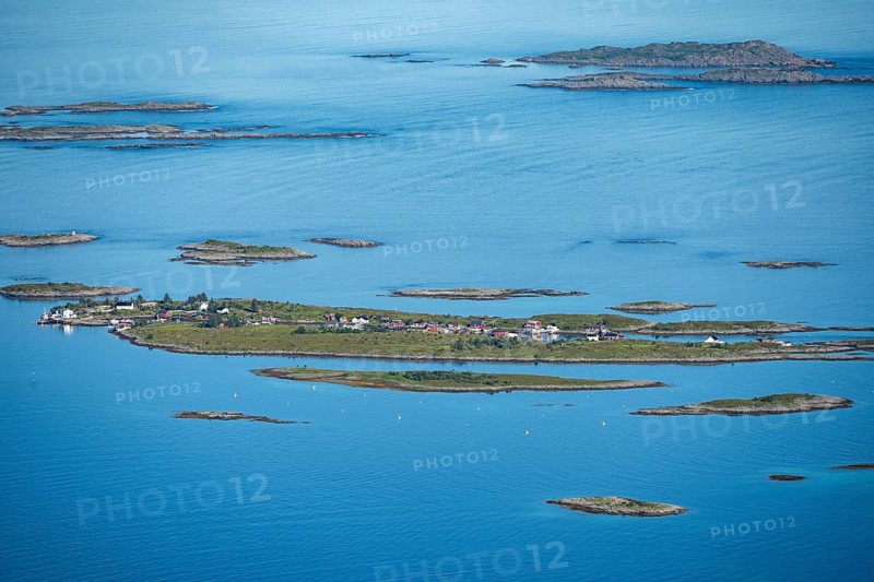 Rocky islands with colourful houses, sea with archipelago islands, Ulvagsundet, Vesteralen, Norway, Europe
