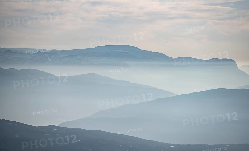 Mountain silhouettes in the evening light, view from the summit of Skala, Loen, Norway, Europe
