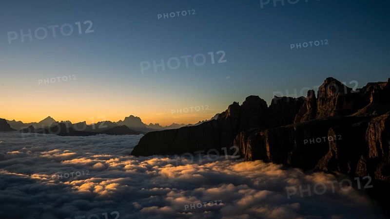 Sunrise over a sea of fog and Dolomite peaks in the background, Corvara, Dolomites, Italy, Europe