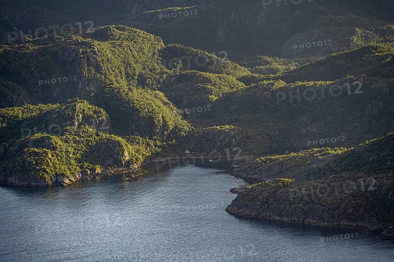 Coast in atmospheric evening light, view from the top of Dronningsvarden or Stortinden, Ulvagsundet, Vesteralen, Norway, Europe