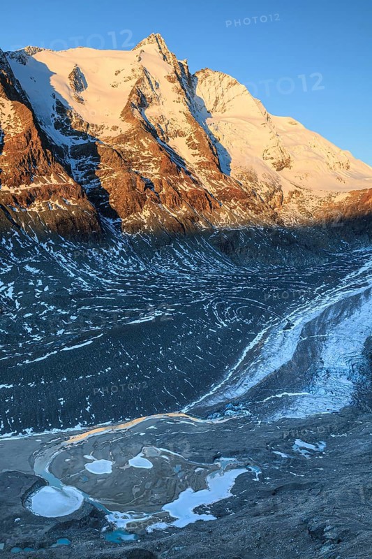Glacier tongue and snow-covered mountain peak at sunrise, Grossglockner and Pasterze, autumn, Hohe Tauern National Park, Carinthia, Austria, Europe