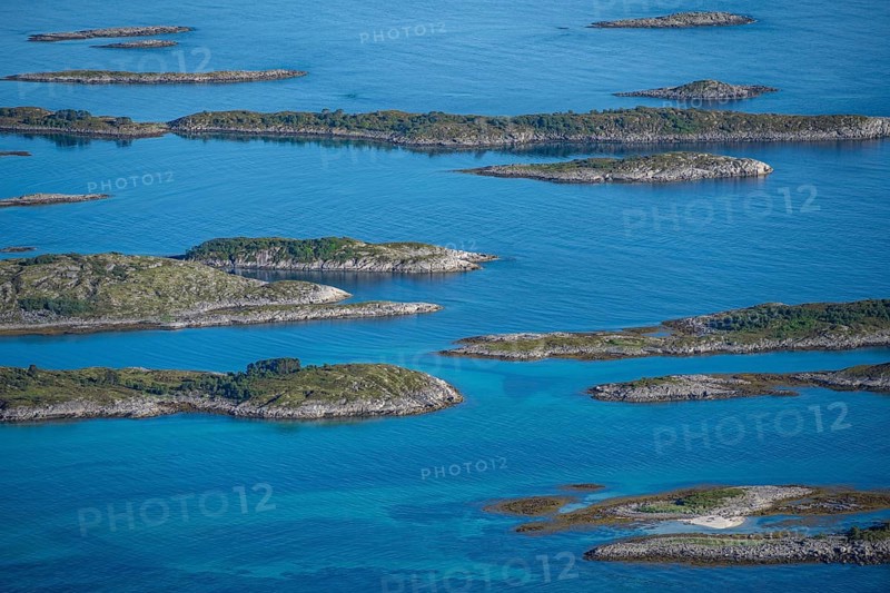 Rocky islands in the blue sea, Sea with archipelago islands, Vesteralen, Norway, Europe