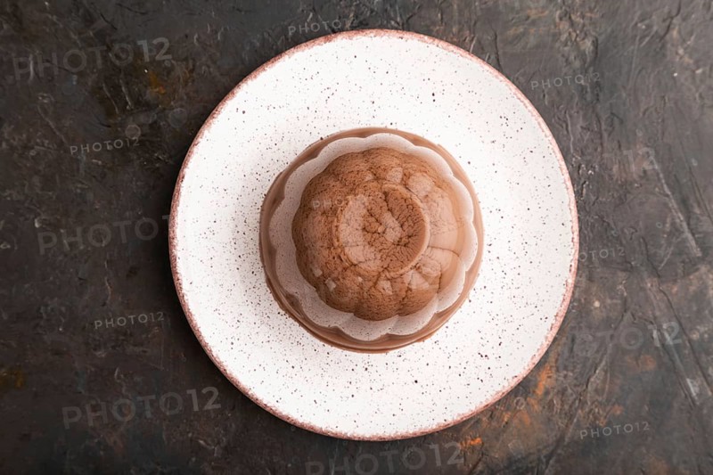 Chocolate jelly on black concrete background. top view, flat lay