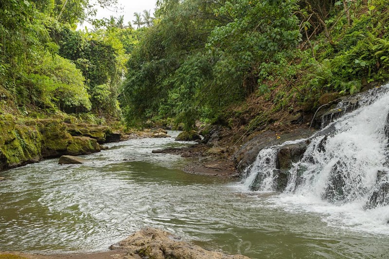 Uma Anyar waterfall, Bali island, Ubud, Indonesia. Jungle, tropical forest, daytime with cloudy sky