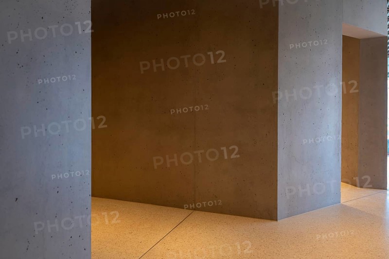 Modern Illuminated Concrete Corridor in a Sunny Day in Switzerland