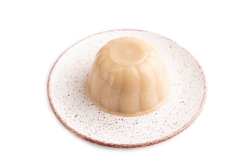Buckwheat milk jelly isolated on white background. side view