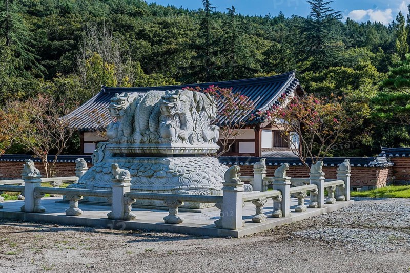Stone carved dragons atop turtle at Buddhist temple in Gimje-si, South Korea, Asia