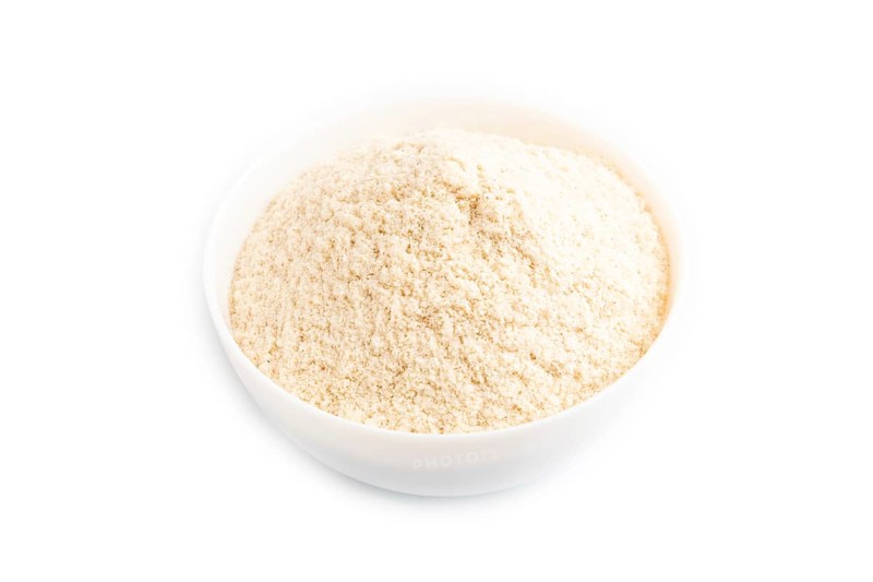 Powdered milk and buckwheat baby food mix, infant formula isolated on white background. Top view, close up, artificial feeding concept