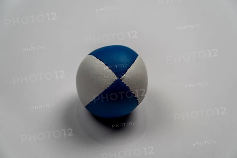 Juggling ball in front of a white background, studio shot, Germany, Europe