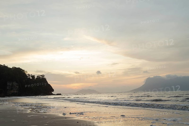 Bako national park, sea sandy beach, overcast, cloudy sunset, sky and sea, low tide. Vacation, travel, tropics concept, no people, Malaysia, Kuching, Asia