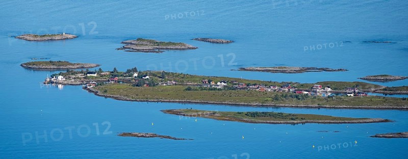 Rocky islands with colourful houses, sea with archipelago islands, Ulvagsundet, Vesteralen, Norway, Europe