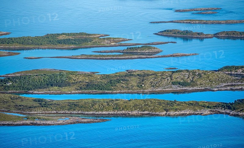 Rocky islands in the blue sea, sea with archipelago islands, Ulvagsundet, Vesteralen, Norway, Europe