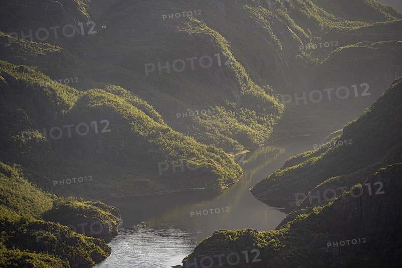 Fjord landscape with atmospheric evening light, Ulvagfjorden fjord and mountains, view from the top of Dronningsvarden or Stortinden, Vesteralen, Norway, Europe