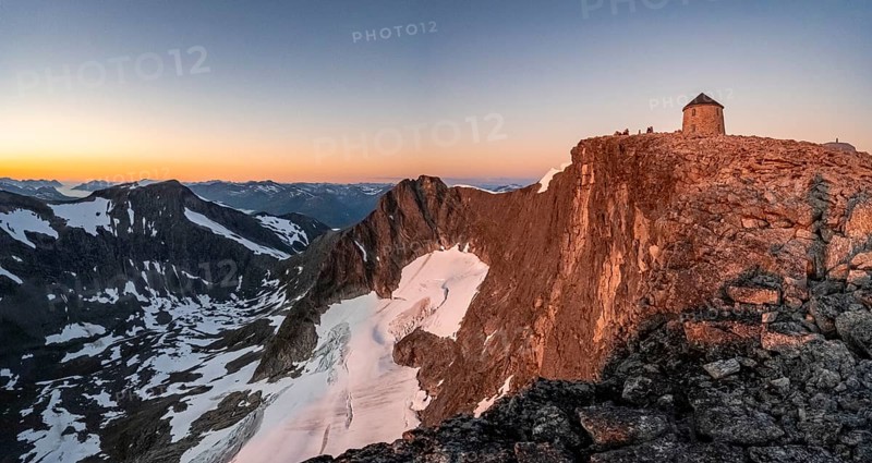 Summit of Skala with DNT's Skalatarnet mountain hut, at sunset, Loen, Norway, Europe