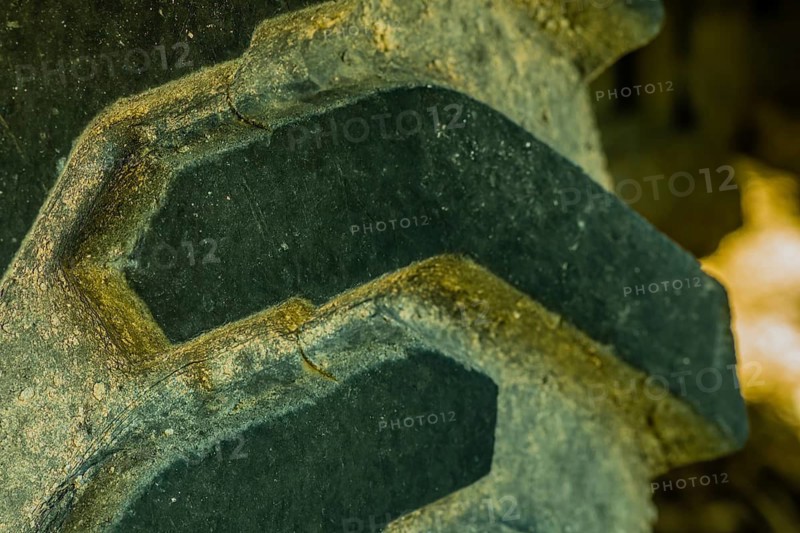 Closeup of tire tread of industrial heavy equipment roadwork machine