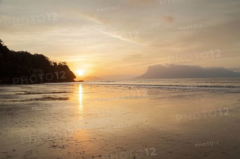 Bako national park, sea sandy beach, overcast, cloudy sunset, sky and sea, low tide. Vacation, travel, tropics concept, no people, Malaysia, Kuching, Asia