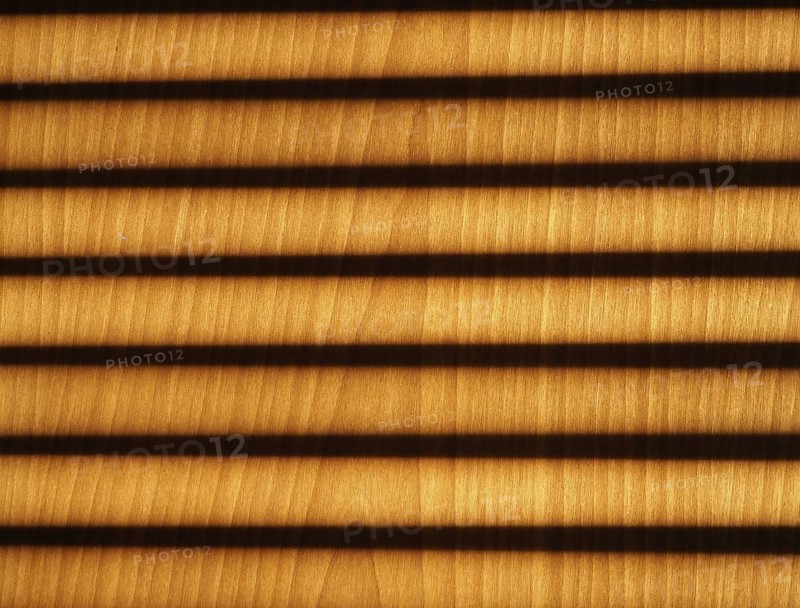 Blinds shadow on wooden wall background