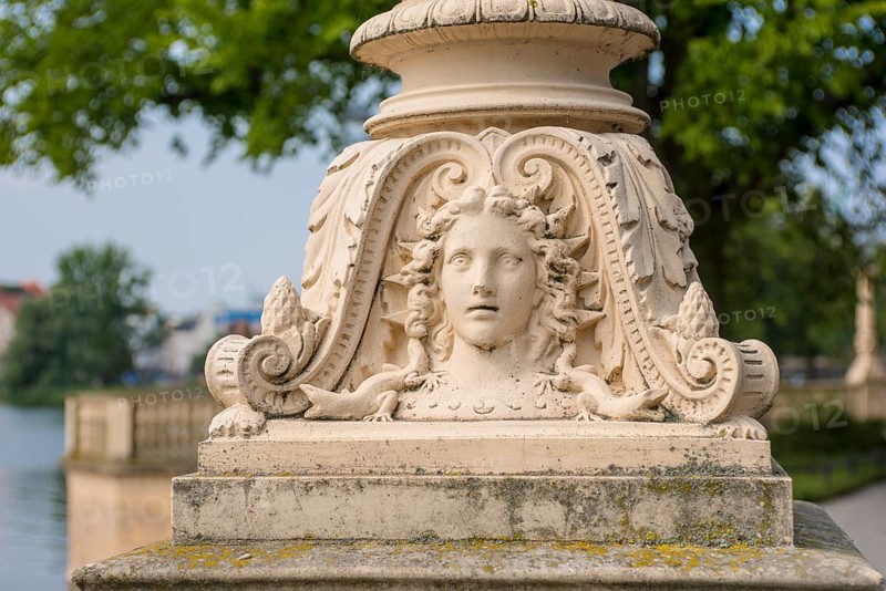 Schwerin Castle, portrait relief in the base of a street lamp with lizard creatures and foliage, Schwerin, Mecklenburg-Western Pomerania, Germany, Europe