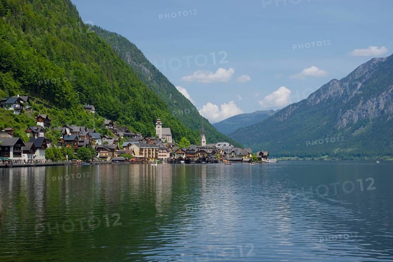 Hallstatt, a charming village on the Hallstattersee lake and a famous tourist attraction, with beautiful mountains surrounding it, in Salzkammergut region, Austria, in summer sunny day, Europe