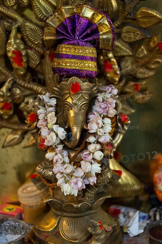 Hindu elephant god Ganesha adorned with a jasmine necklace, India, Asia