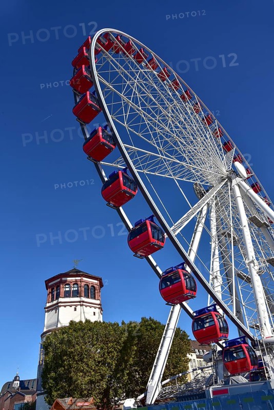 View over the Rhine terrace of Duesseldorf with the castle tower and the Ferris wheel of the funfair, North Rhine-Westphalia, Germany, Europe