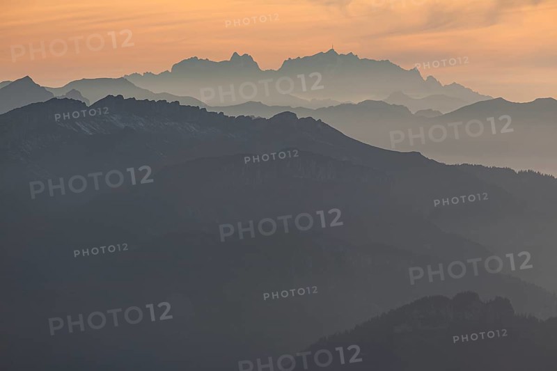 Silhouette of a mountain peak in the evening light, haze, backlight, autumn, view from the Nebelhorn to Hoher Ifen and Saentis, Allgaeu Alps, Allgaeu, Germany, Europe