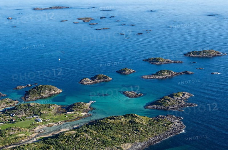 Coast and rocky islands in the blue sea, sea with archipelago islands, Ulvagsundet, Vesteralen, Norway, Europe