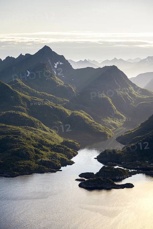Fjord landscape with atmospheric evening light, Ulvagfjorden fjord and mountains, view from the top of Dronningsvarden or Stortinden, Vesteralen, Norway, Europe