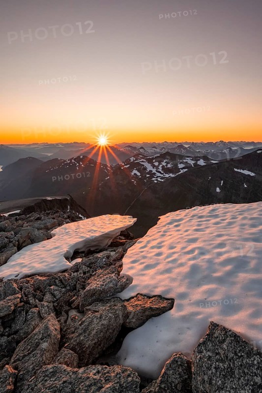 View of mountain panorama, sun star at sunset, summit of Skala, Loen, Norway, Europe