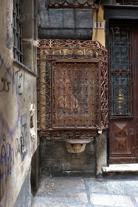 18th century Madonna and Child, protected by a wrought iron grille, in the historic centre, Al civ. 11 r. di Vico cinque Lampadi, Genoa, Italy, Europe