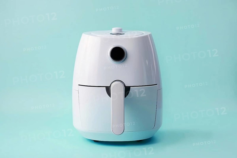 Air fryer on blu ebakcground. KI generiert, generiert AI generated