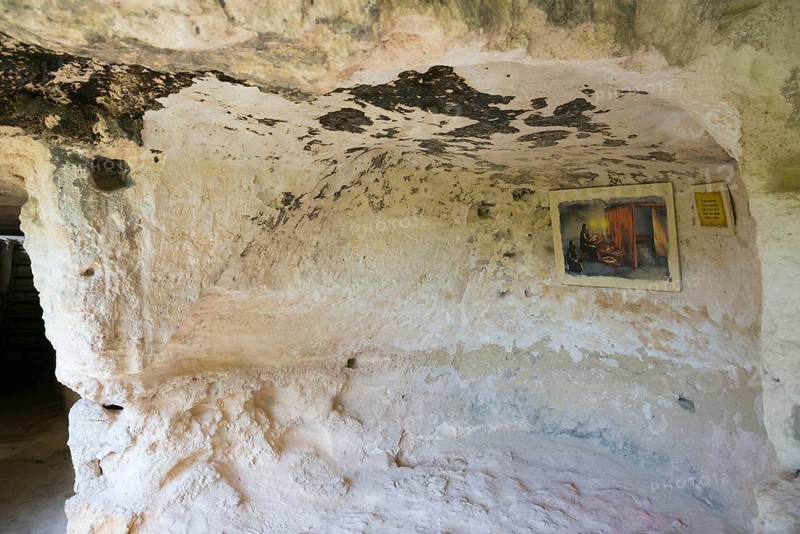 A rock cave with a mural and an information panel, abbot's cell, Aladja Monastery, Aladja Monastery, Aladzha Monastery, medieval rock monastery, cave monastery in the limestone cliff, Varna, Black Sea coast, Bulgaria, Europe