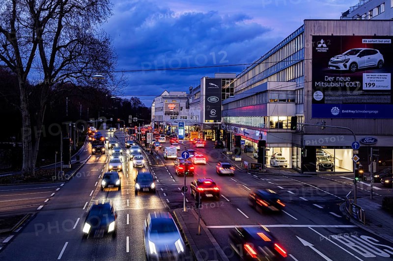 Cars with light trails in the evening, city centre traffic on busy B14 federal road at Neckartor, Stuttgart, Baden-Württemberg, Germany, Europe