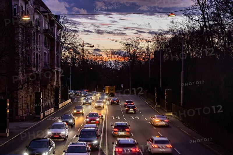 Cars with light trails in the evening, city centre traffic on busy B14 federal road at Neckartor, Stuttgart, Baden-Württemberg, Germany, Europe