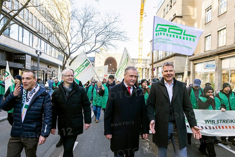 Strike by the train drivers' union GDL. Strike demonstration through the city centre. Claus Weselsky, Federal Chairman of the GDL, leads the protest march, next to him Kai Rosenberger, Chairman of the Civil Servants Association BW (right) and Lutz Dächert, Chairman of the GDL South-West District, Stuttgart, Baden-Württemberg, Germany, Europe