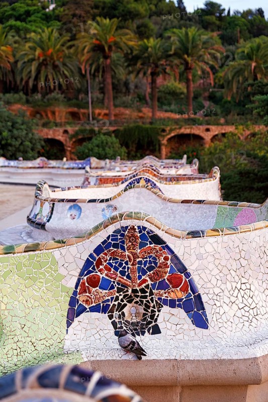 Curved bench, ceramic mosaic, Trencadis, viewing platform at sunrise, Park Güell, Barcelona, SpainTrencadis